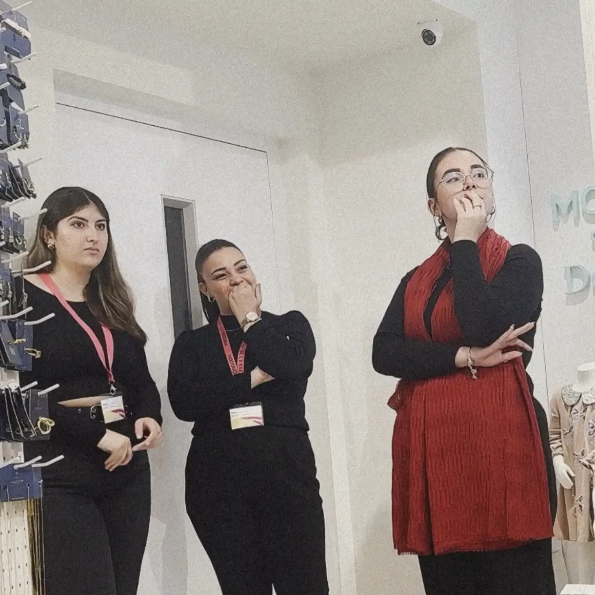 Store employees all looking at bulge flash