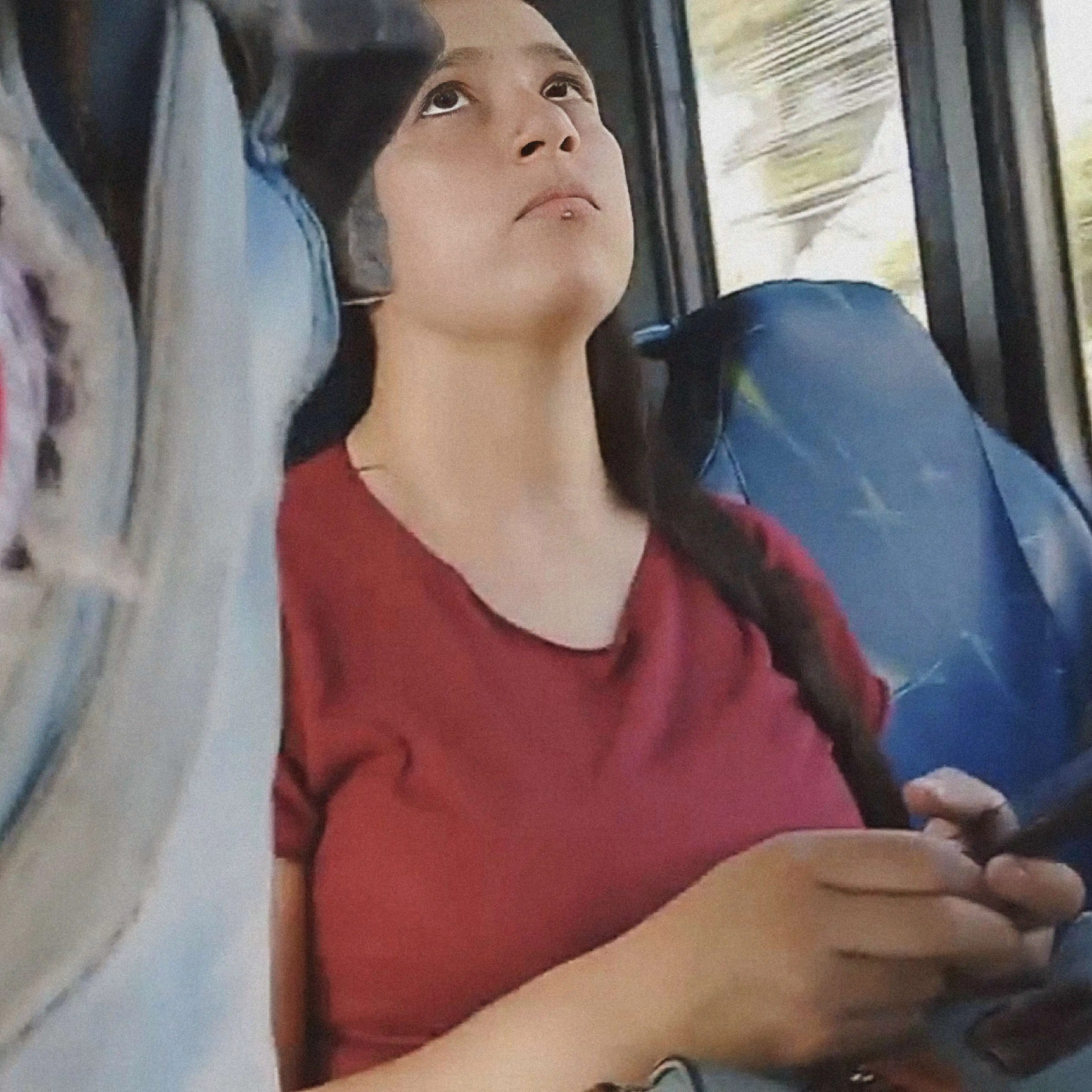 Sexy Brazilian suspiciously looking at the bulge on the bus