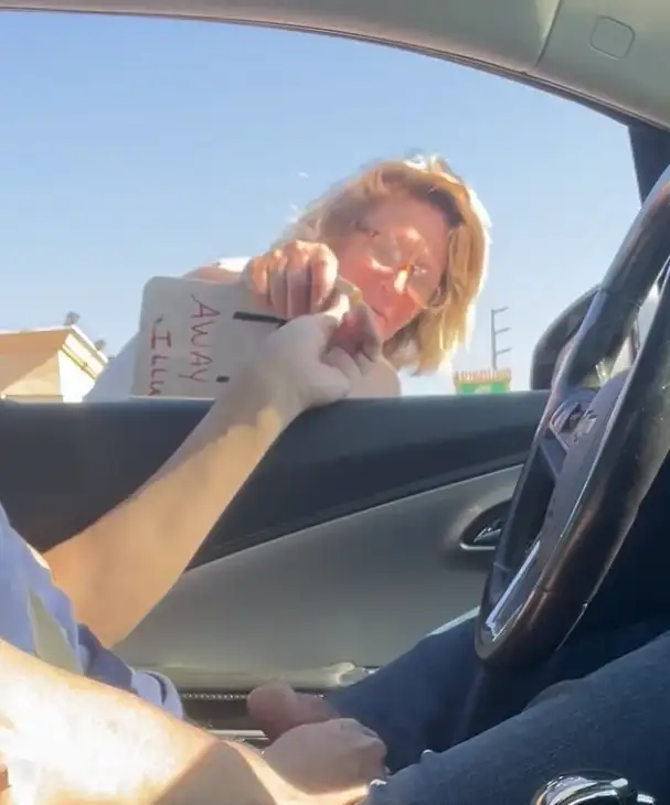Giving Money to a Beggar at the Traffic Light