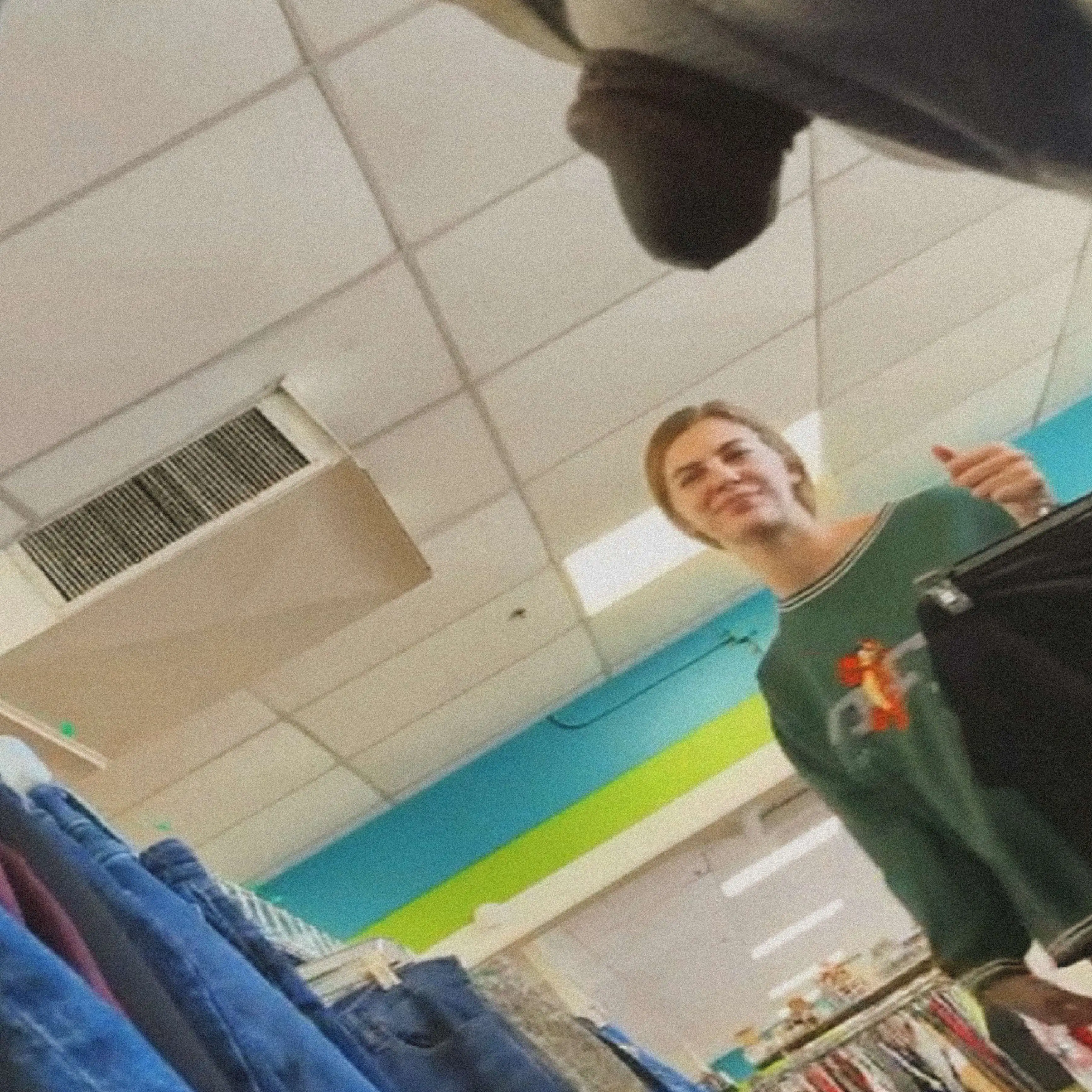 Hot blonde friendly smiling in clothing store