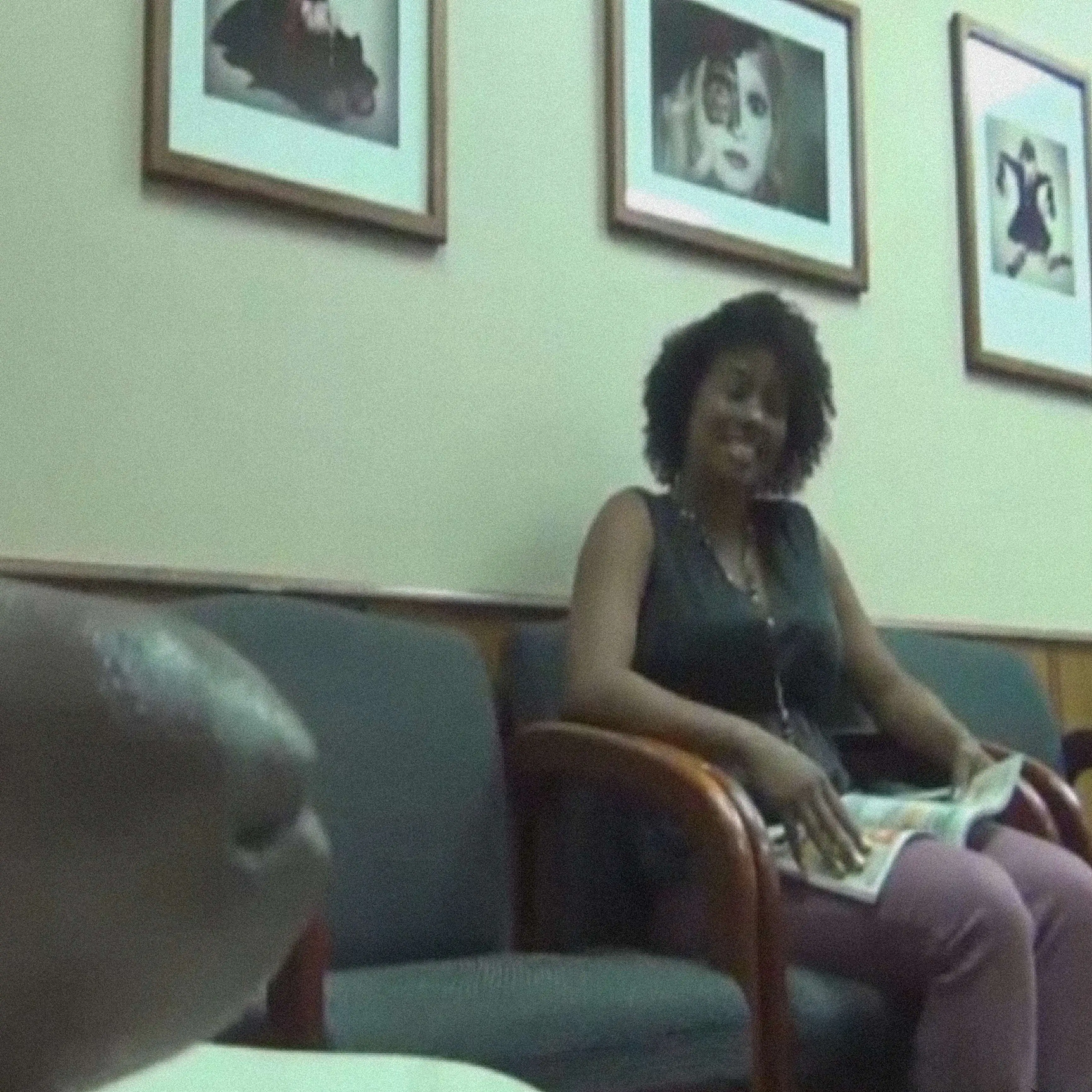 Smiling ebony looking at black dick in waiting room
