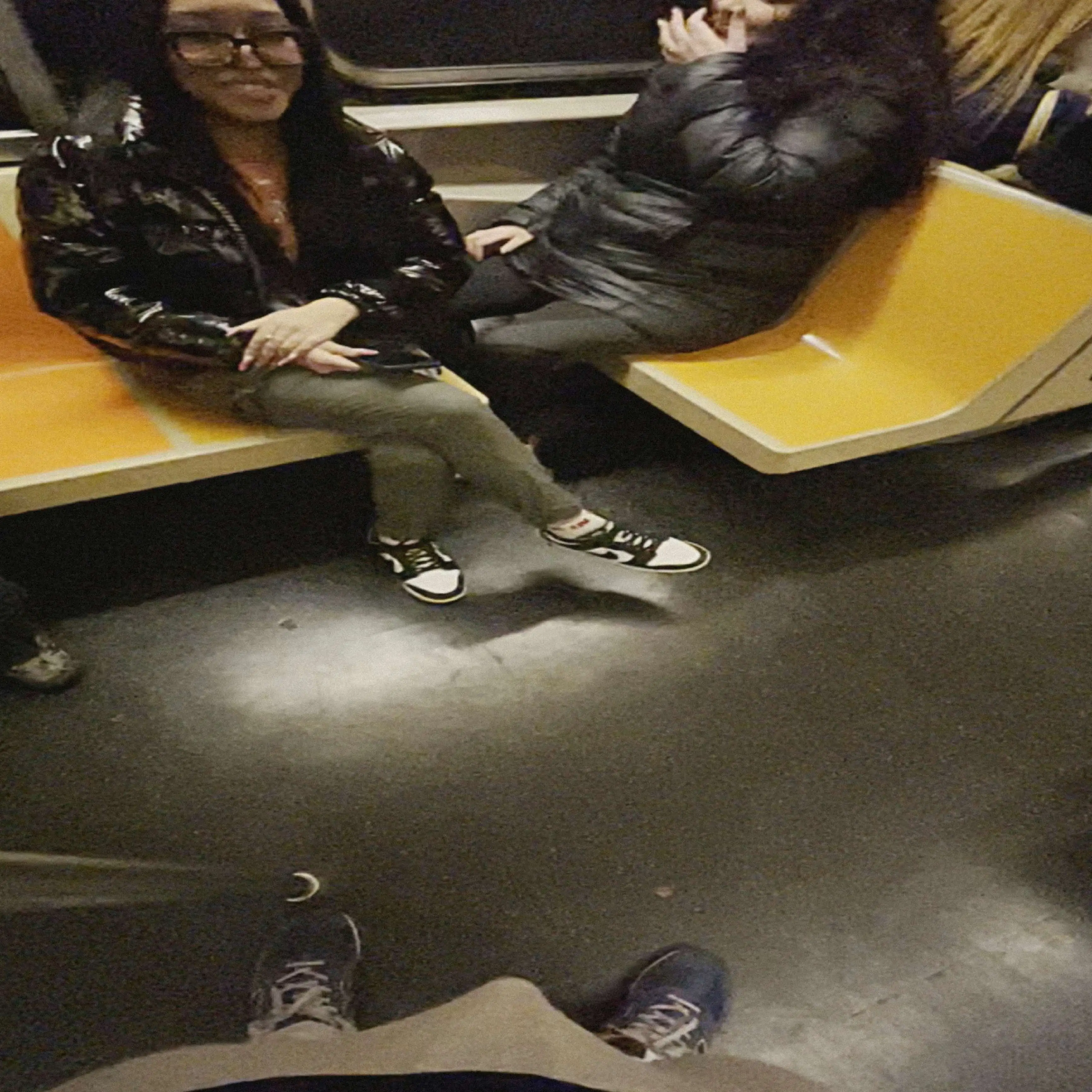 Sexy friends smiling and looking at bulge on train