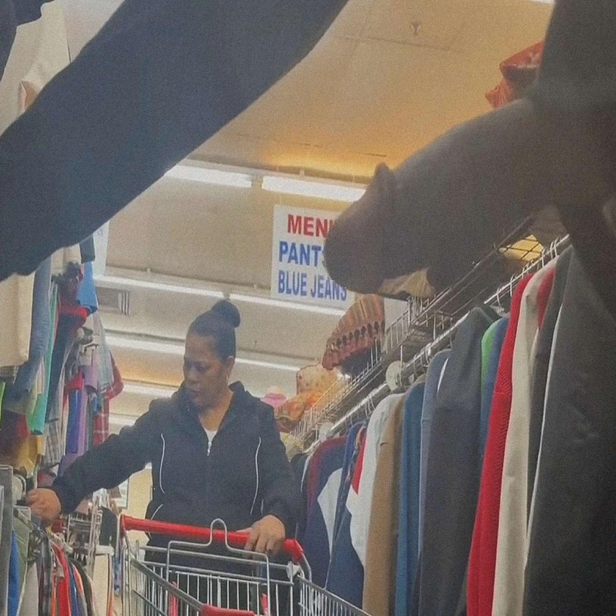 Mature looking at clothes in the store