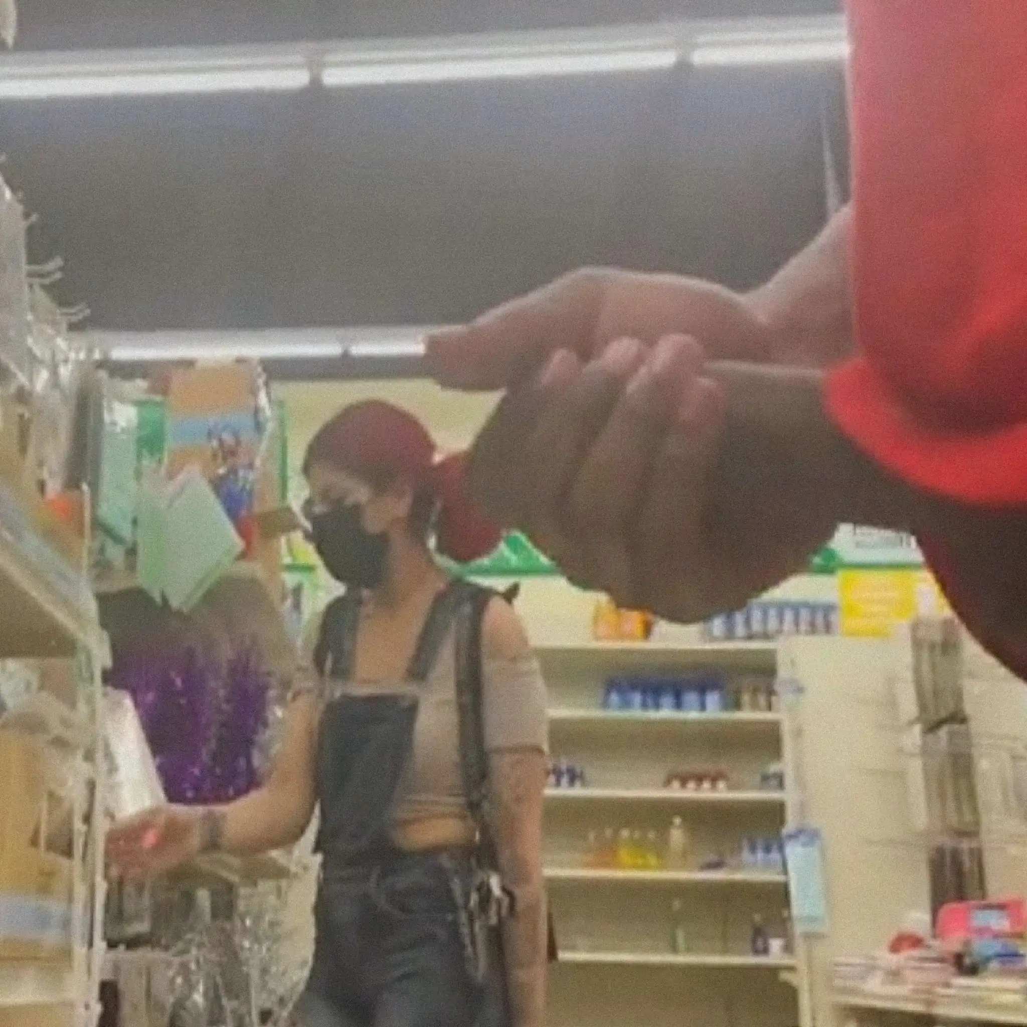 Hot redhead teen looking at products in the store