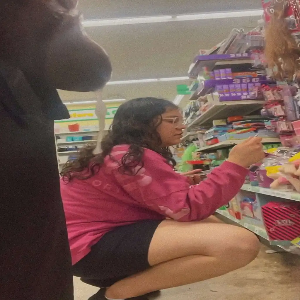 Sexy chubby looking at the products in the store