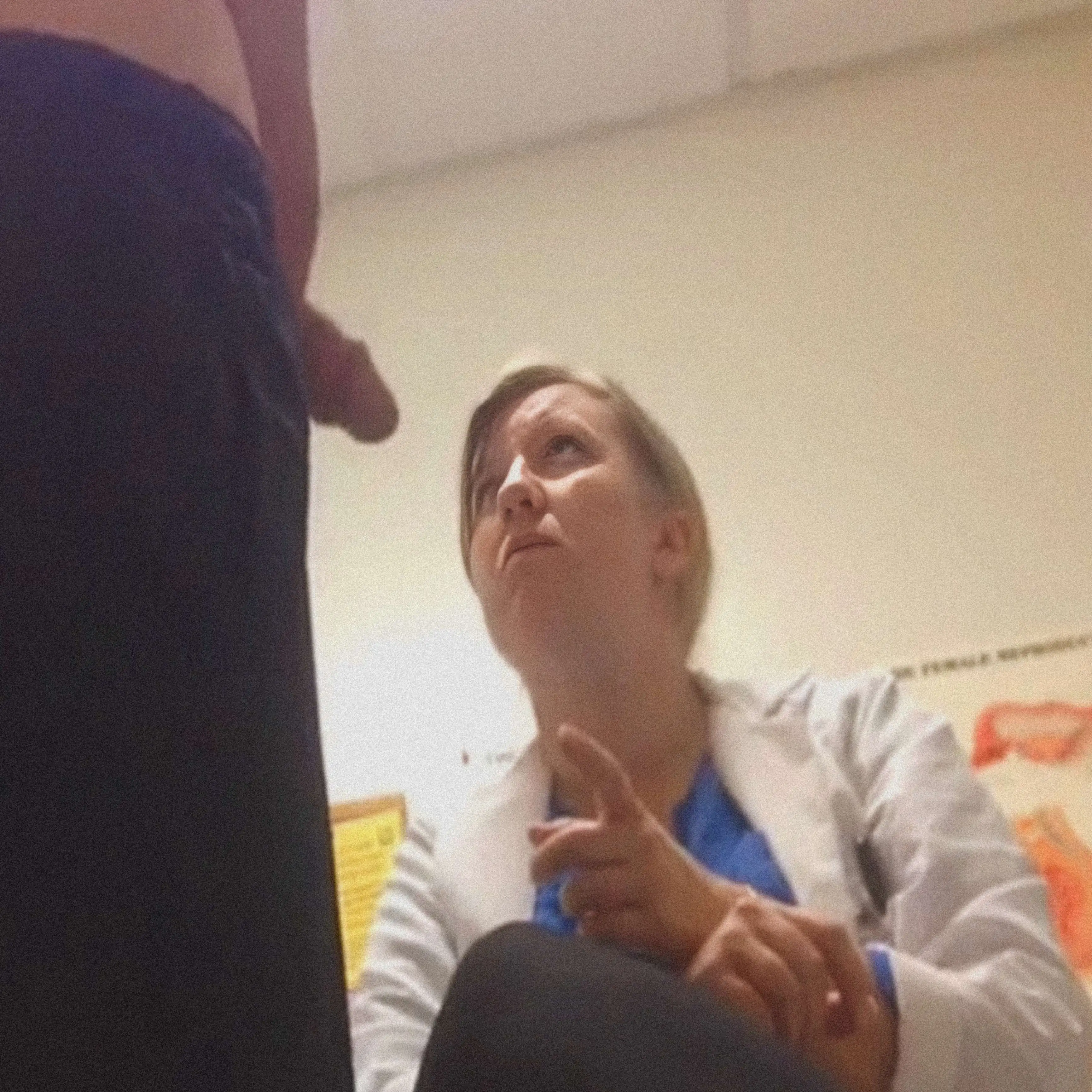 Blonde Milf doctor examining penis