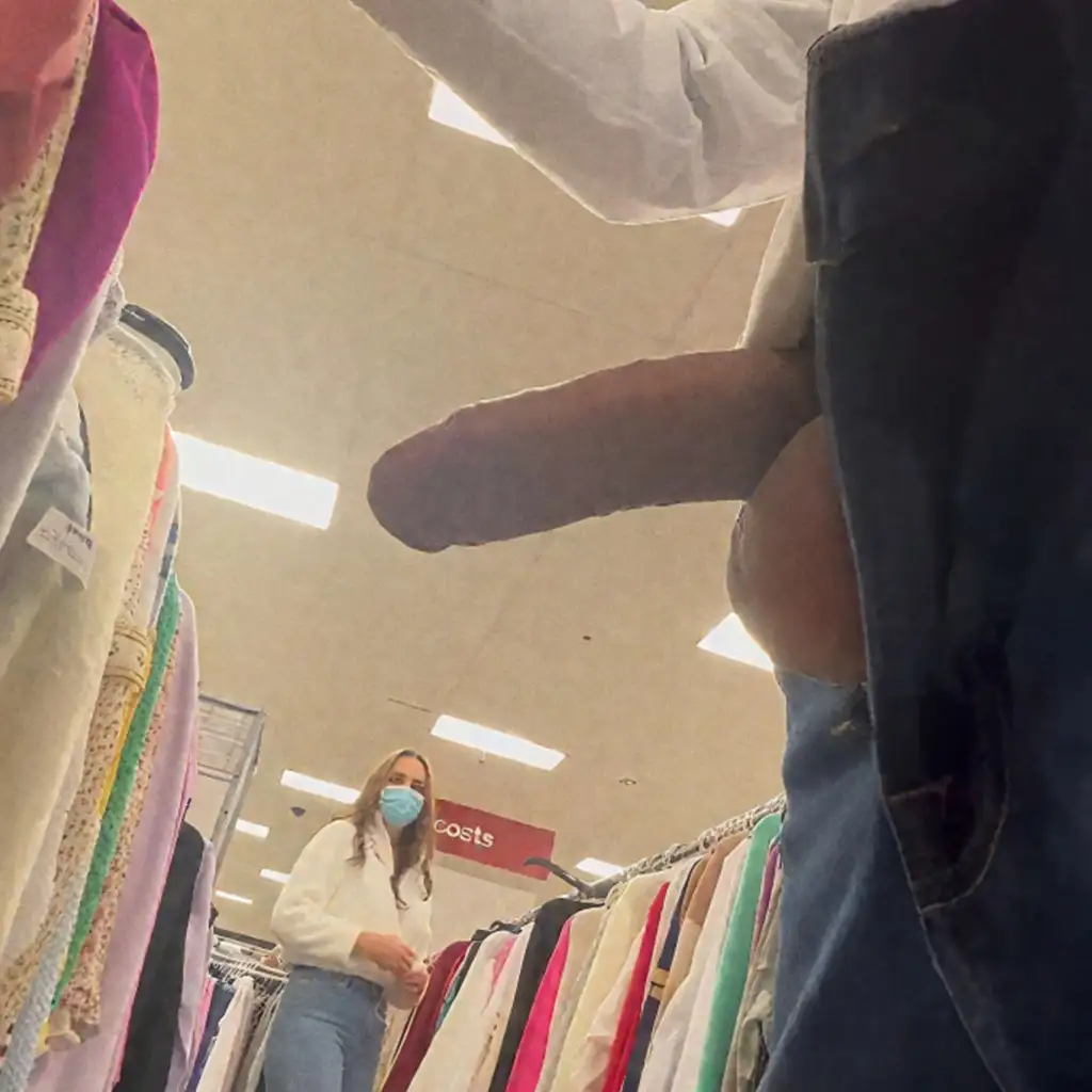 Hot milf looking at the clothes and the dick too