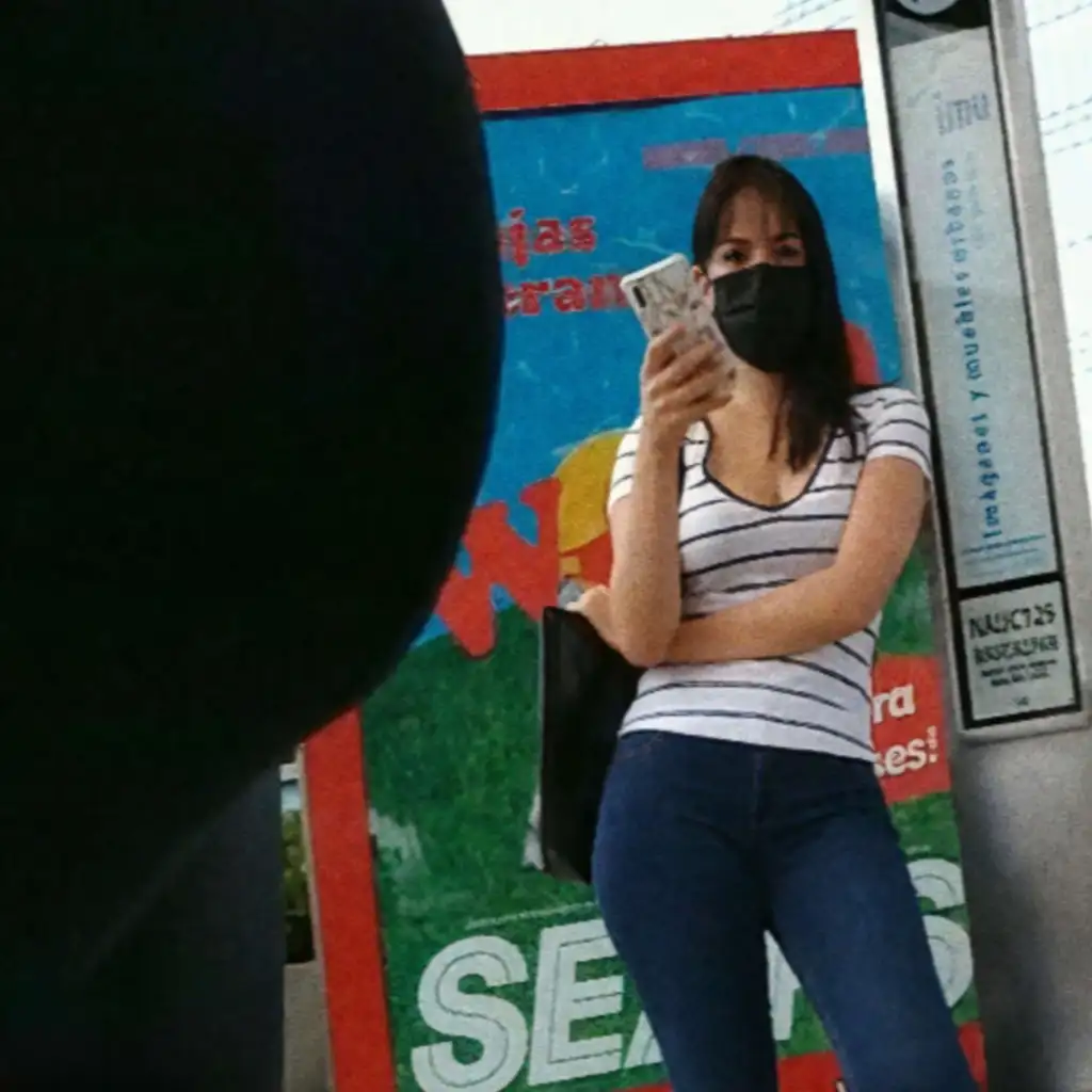 Hot black mask looking bulge at bus stop