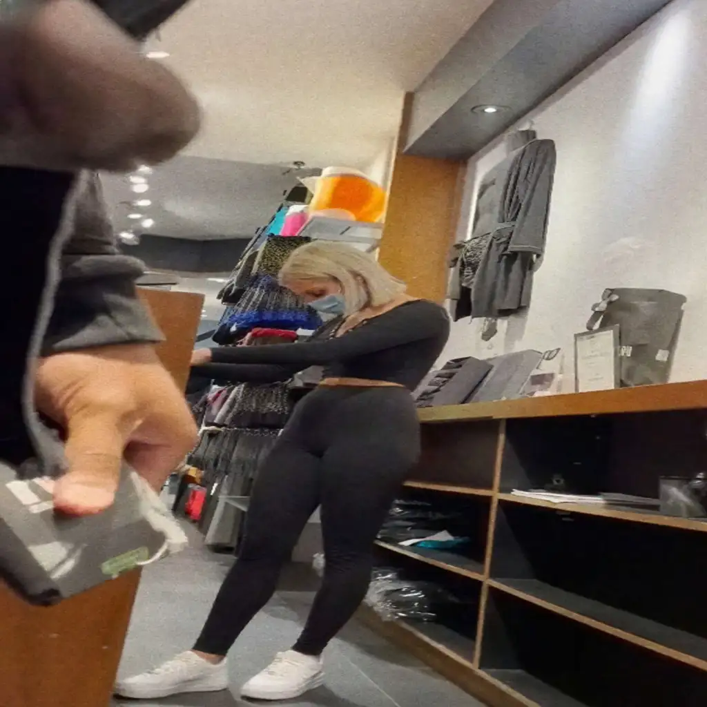 Hot blonde saleswoman looking at black dick