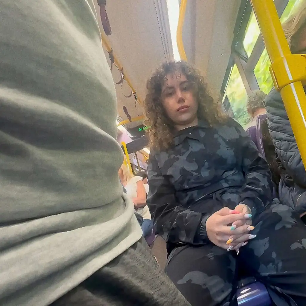 Sexy curly girl looking bulge on the train, she liked it and took a picture