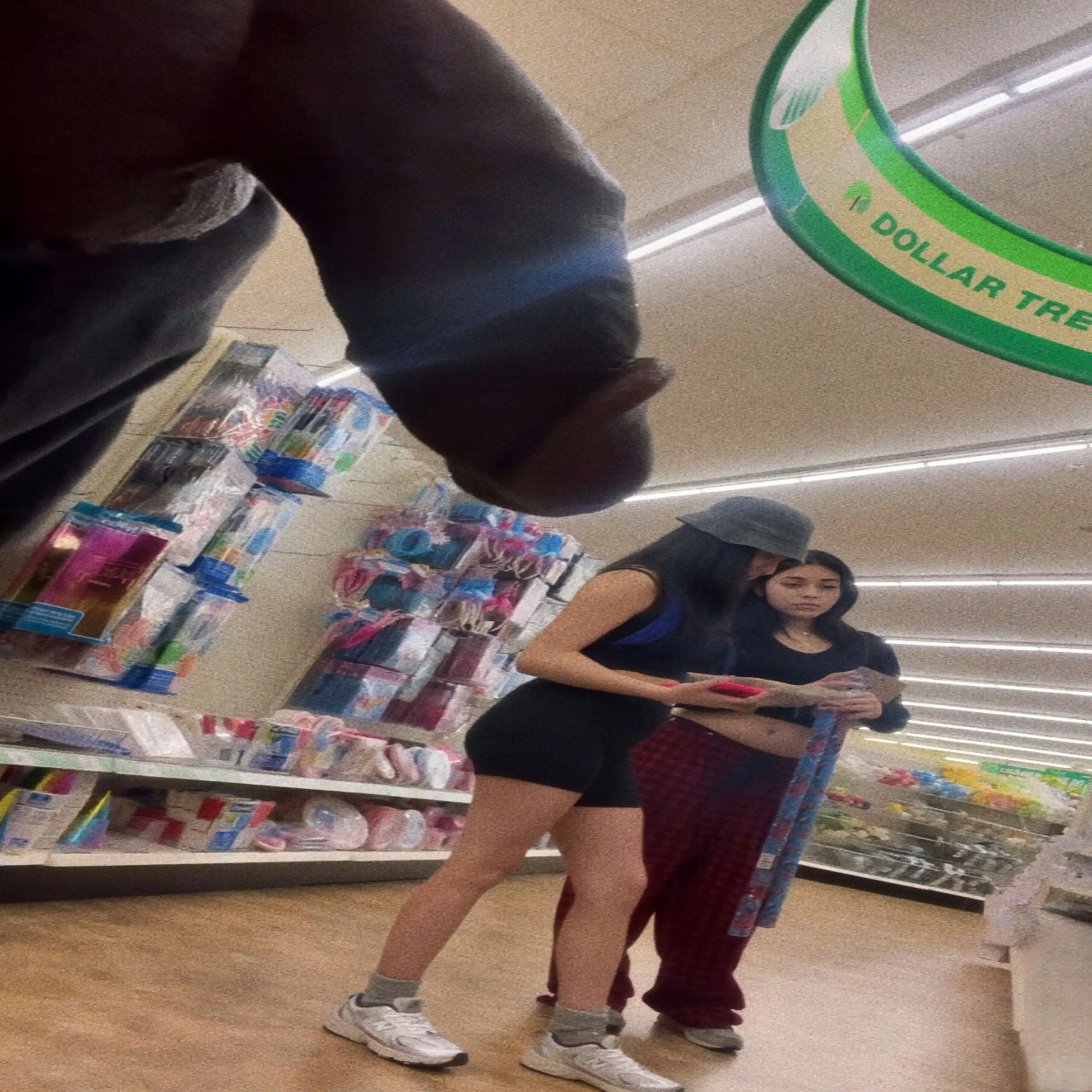 Two hot teens looking at products in the store