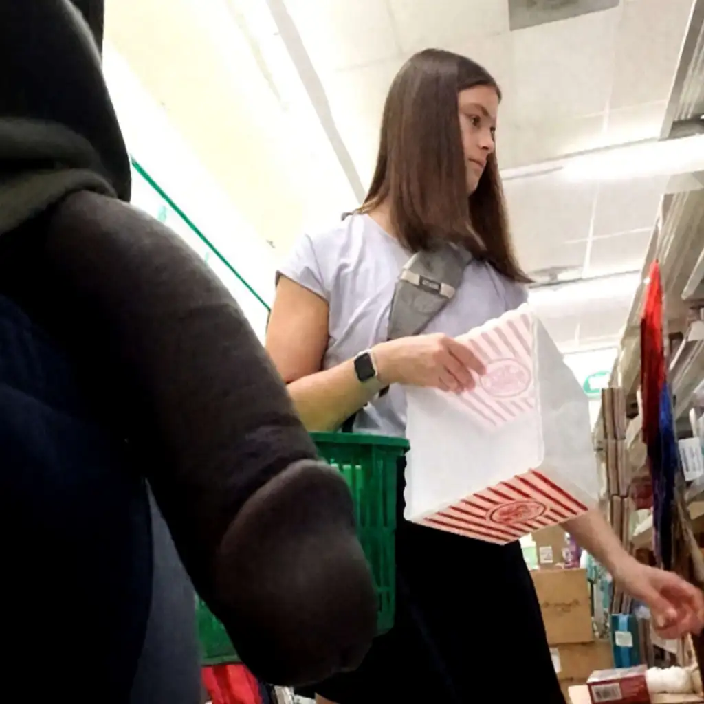 Hot young woman looking at products in the store