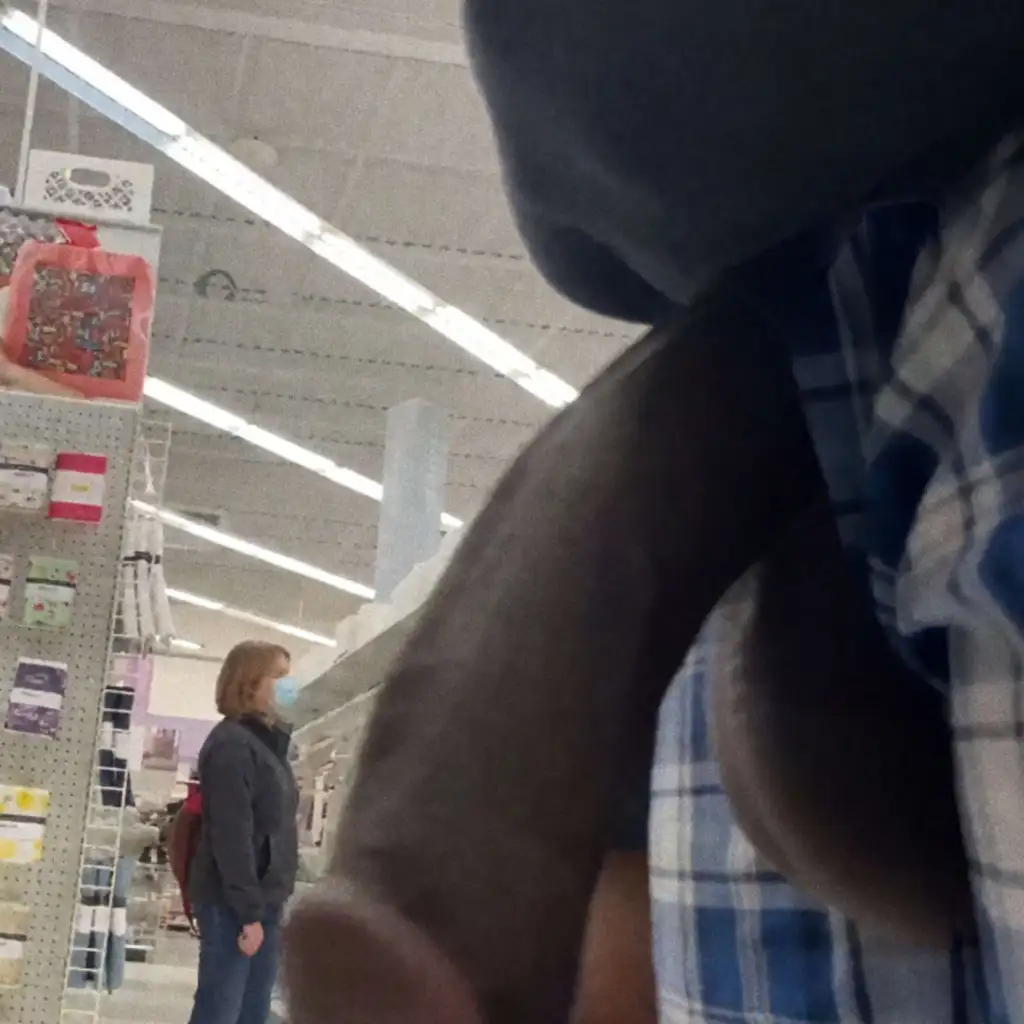 Mature looking at huge black dick in store