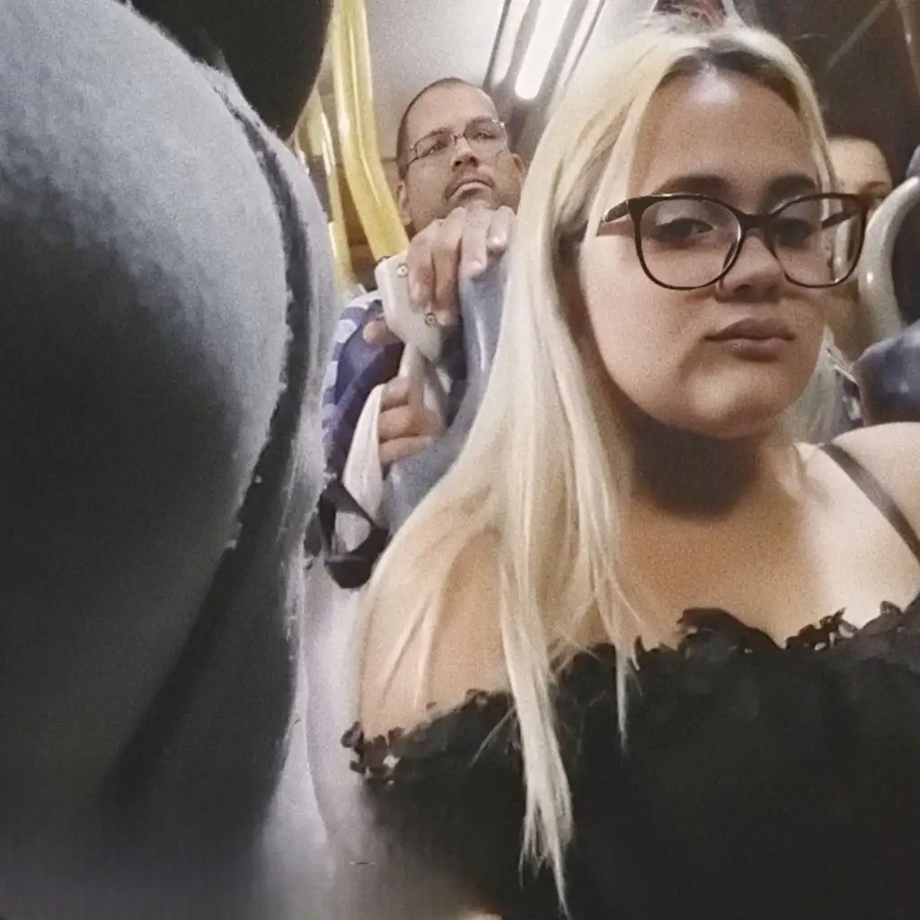 Naughty Brazilian blonde looking at bulge on the bus