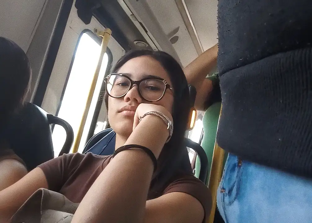 Brazilian nerdy brunette looking at the bulge flash on the bus