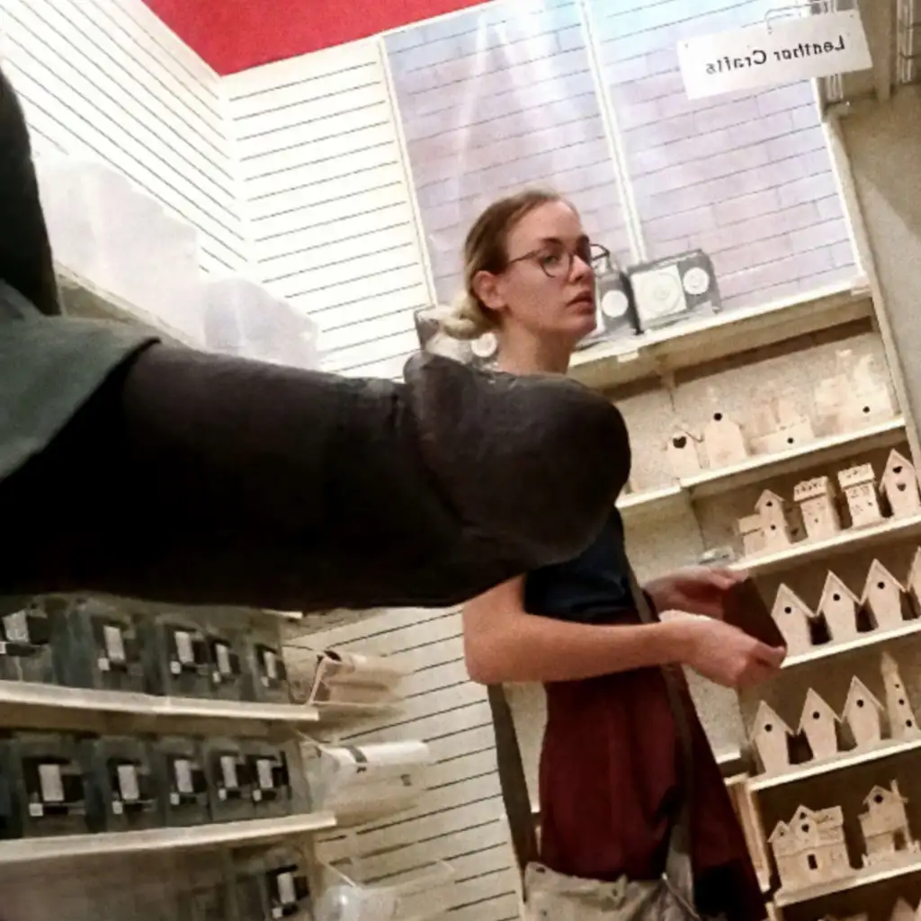 Cute skinny blonde looking at products in the store