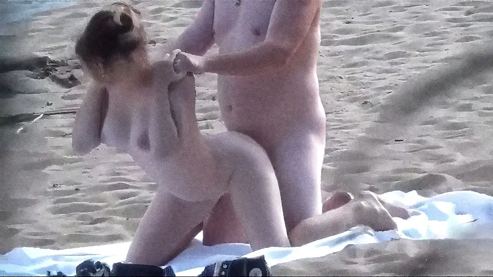 Couple having sex on a nude beach