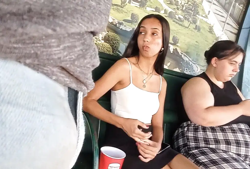 Sexy Brazilian brunette at the bus stop