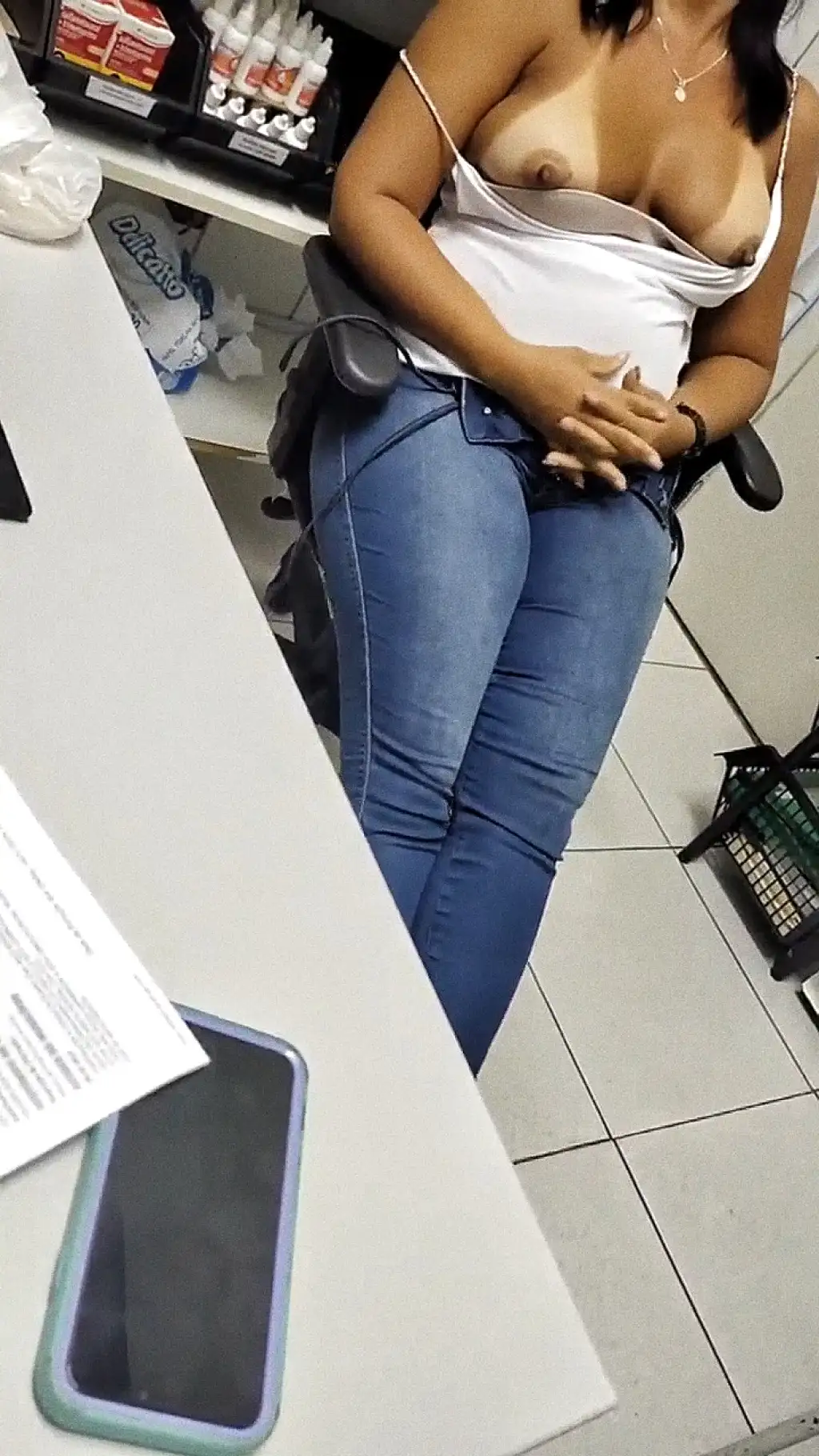 Slutty Brazilian coworker showing her big tits at work