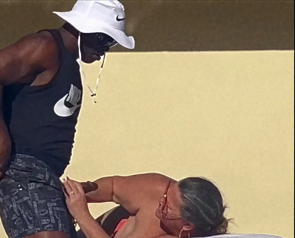 Blonde MILF helping black cock in the resort pool