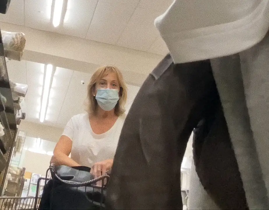 Mature blonde looking at huge black dick in store
