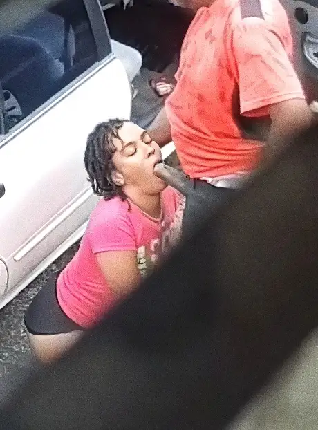 Slutty brunette caught giving blowjob to huge black cock on the street