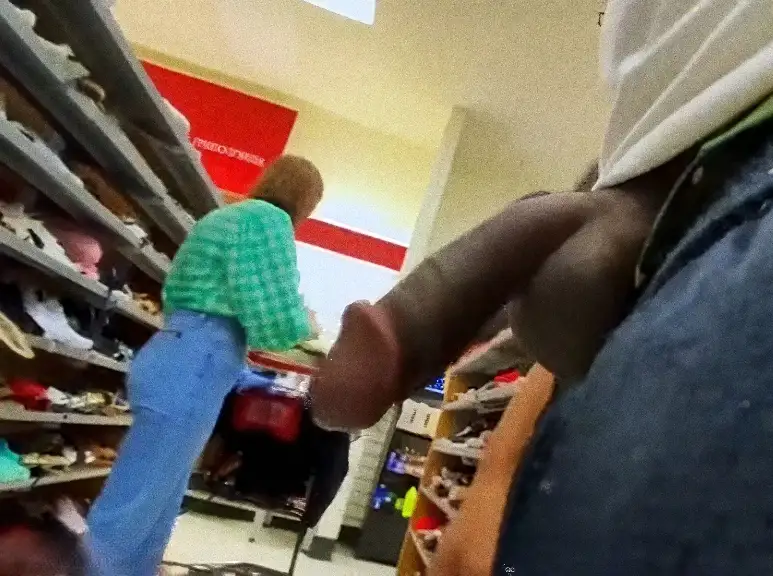Beautiful young woman in the shoe store