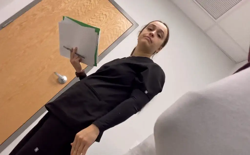 Clinic attendant looking at bulge