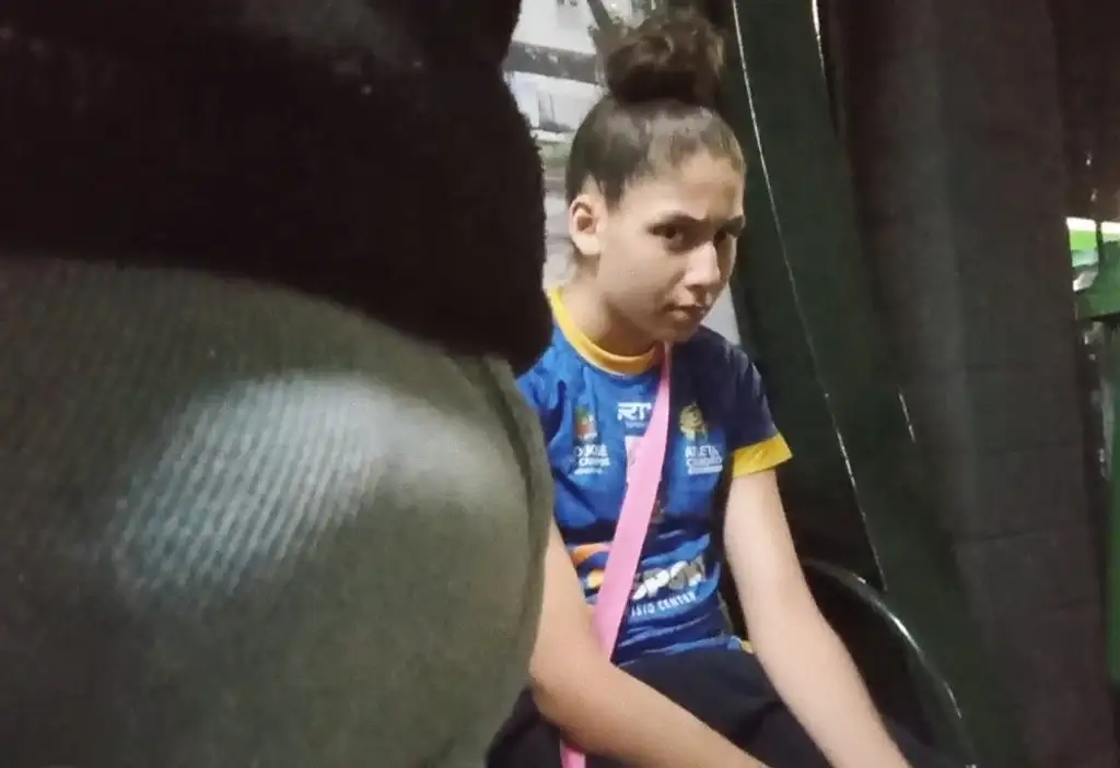 Suspicious Brazilian teen looking at bulge at bus stop