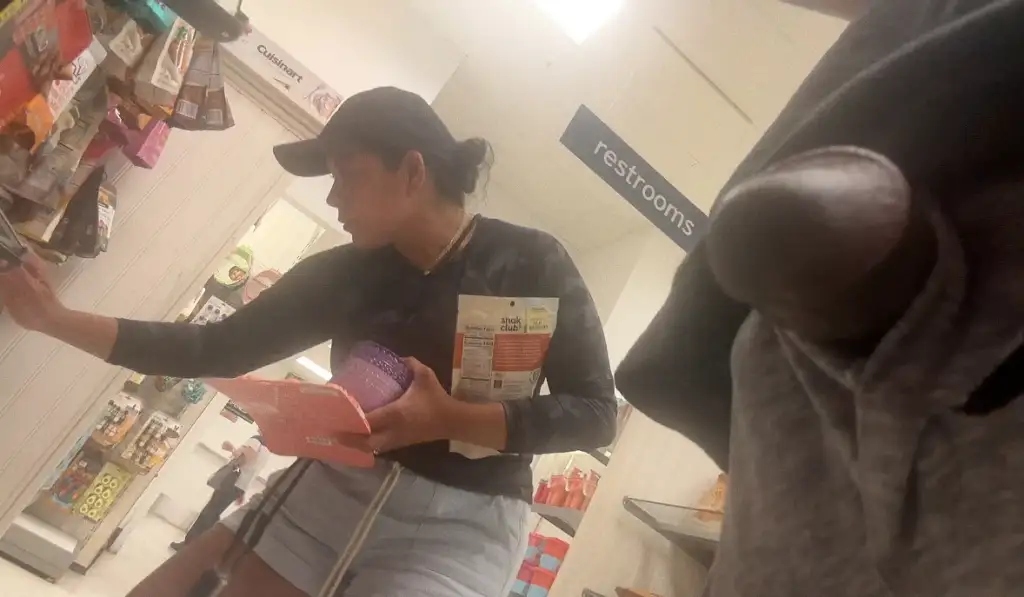 Latina brunette looking at products in the store