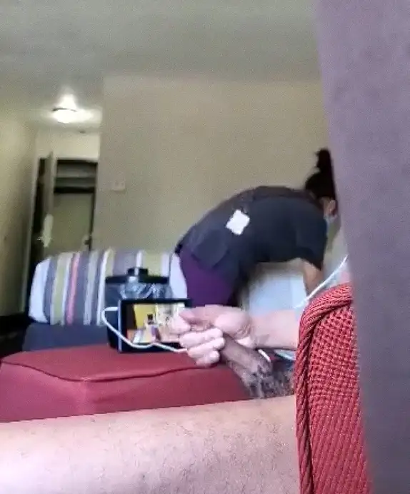 Jerk off and hotel maid tidying the room