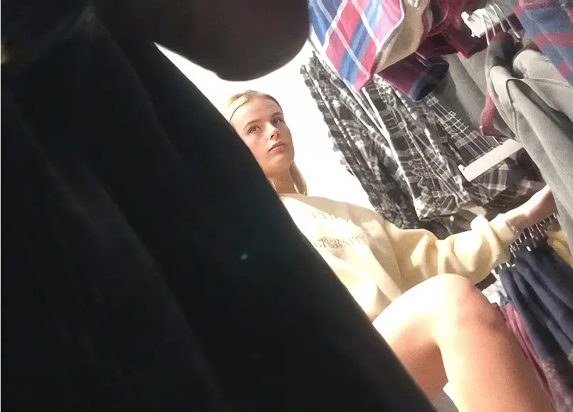 Hot blonde employee looking at black dick in the store