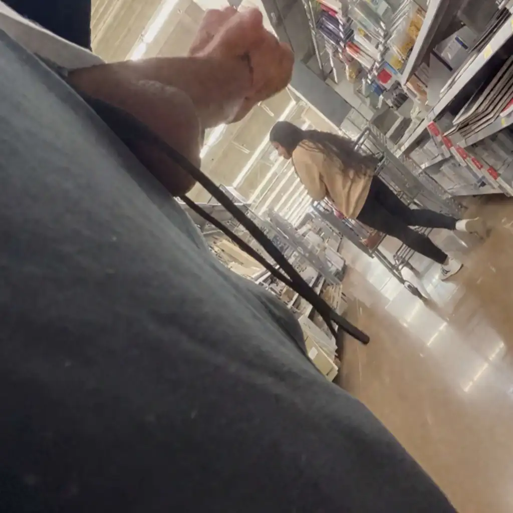 Teen latina strolling in the store looking at products