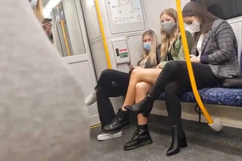 Four friends looking bulge on the train