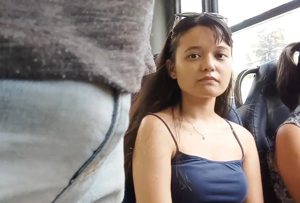 Sexy Asian Brazilian girl looking at a bulge on the bus