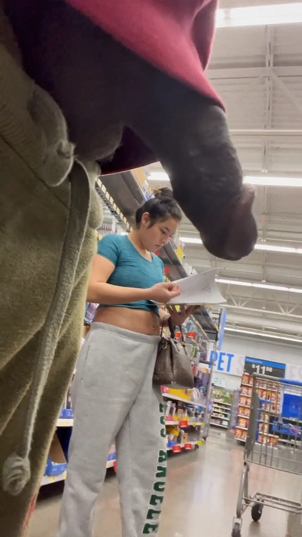 Hot teen looking at the products very close to the black dick