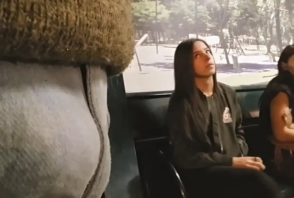 Sexy Brazilian looking at a bulge at the bus stop