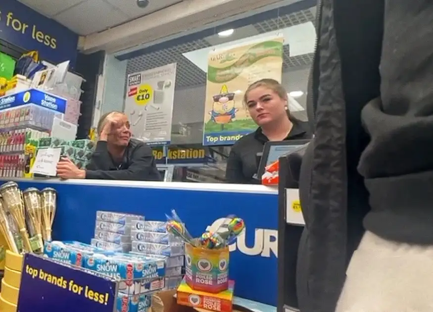 Happy employees looking at customer bulge