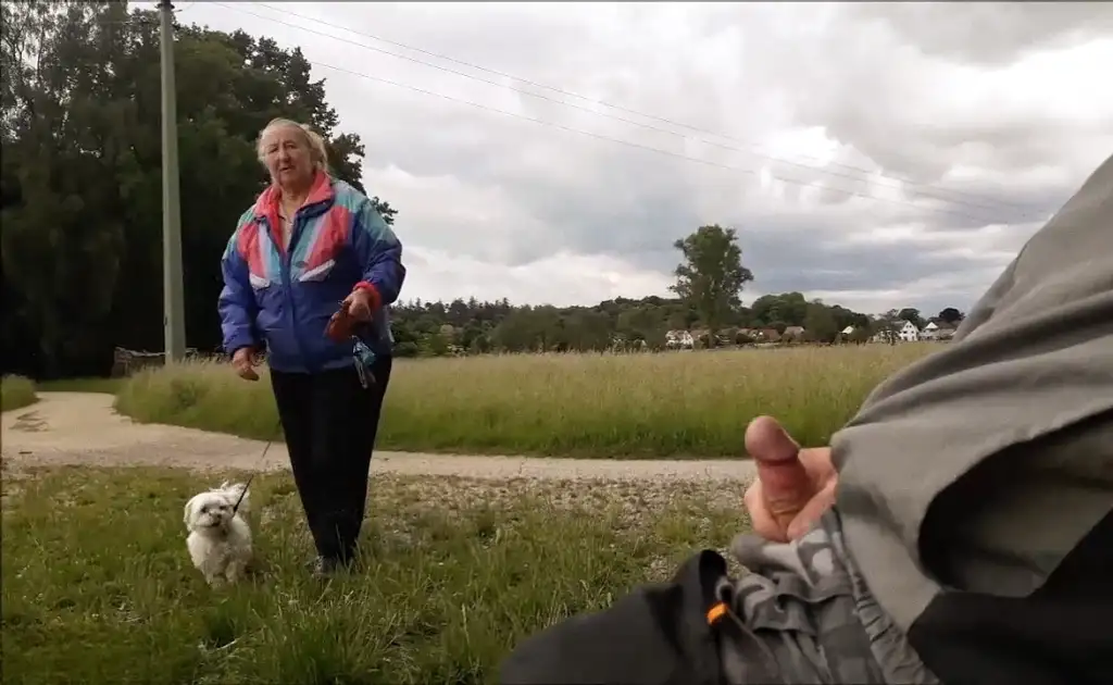 Mature walking the dog near the jerk off 