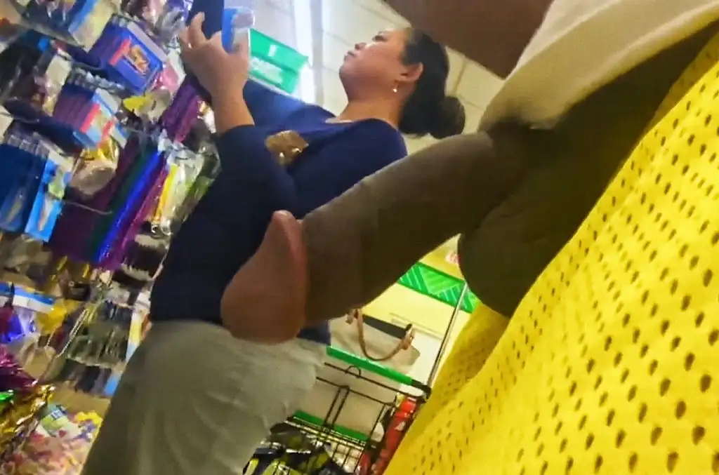 Black dick next to the mature Latina in the store