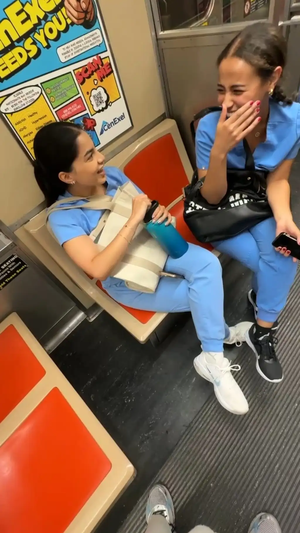 Two nurses looking at bulge on train