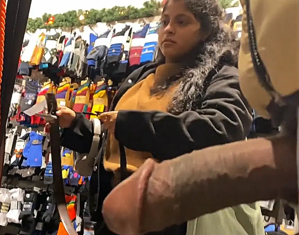Arab brunette looking at products in the store and big dick in front