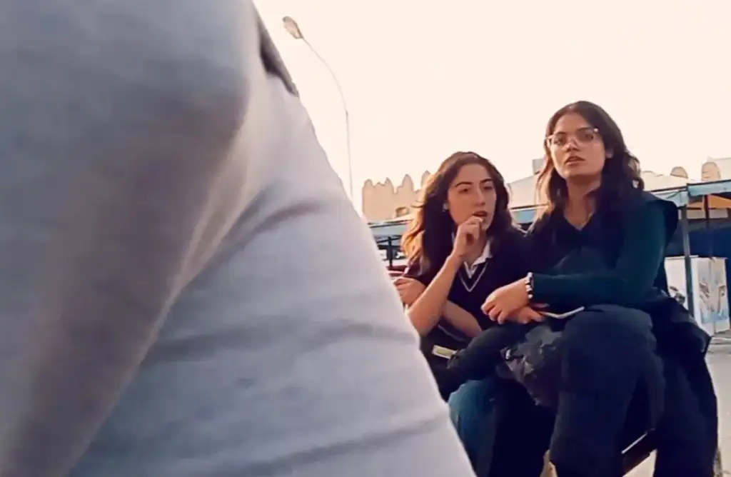 Naughty students checking out bulge at the bus stop