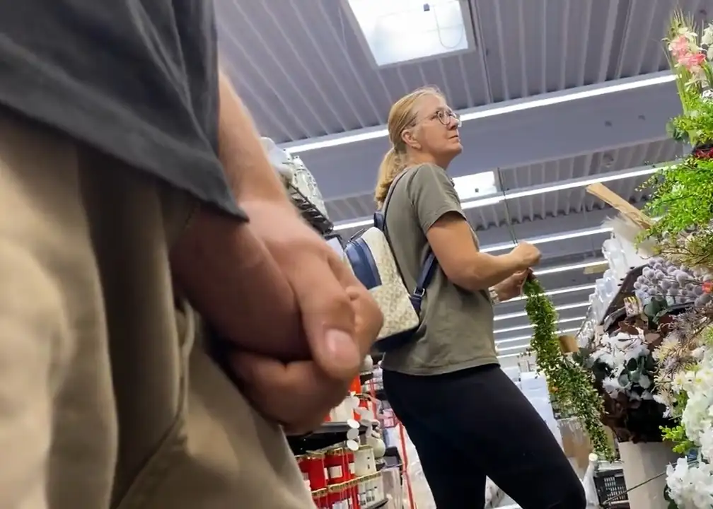 Sexy mature blonde in the store