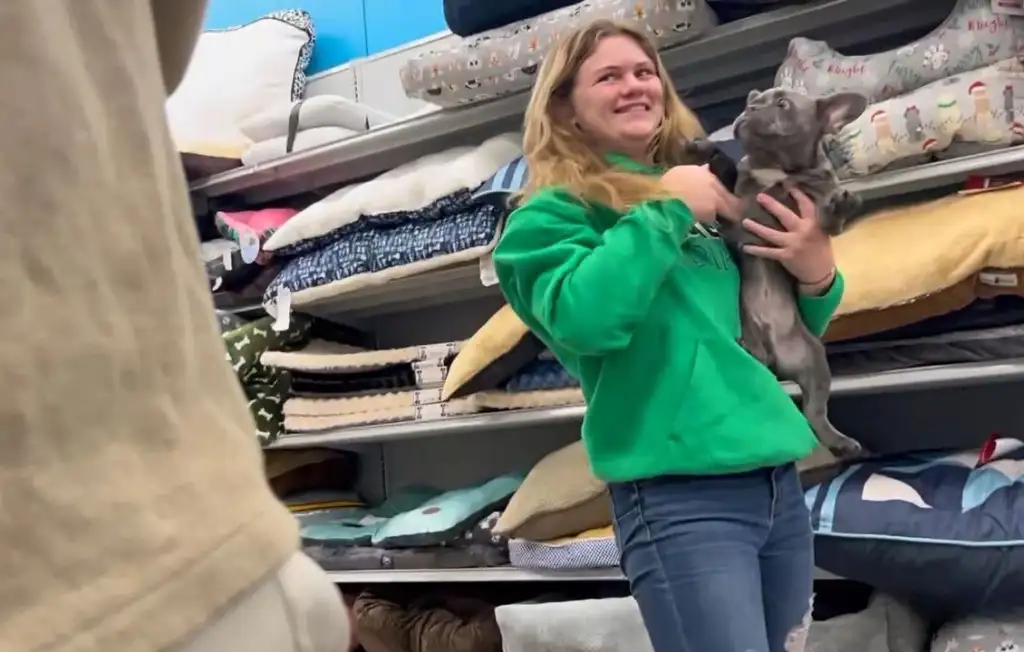 Hot blonde smiling with her dog in the store, she saw the bulge and liked it