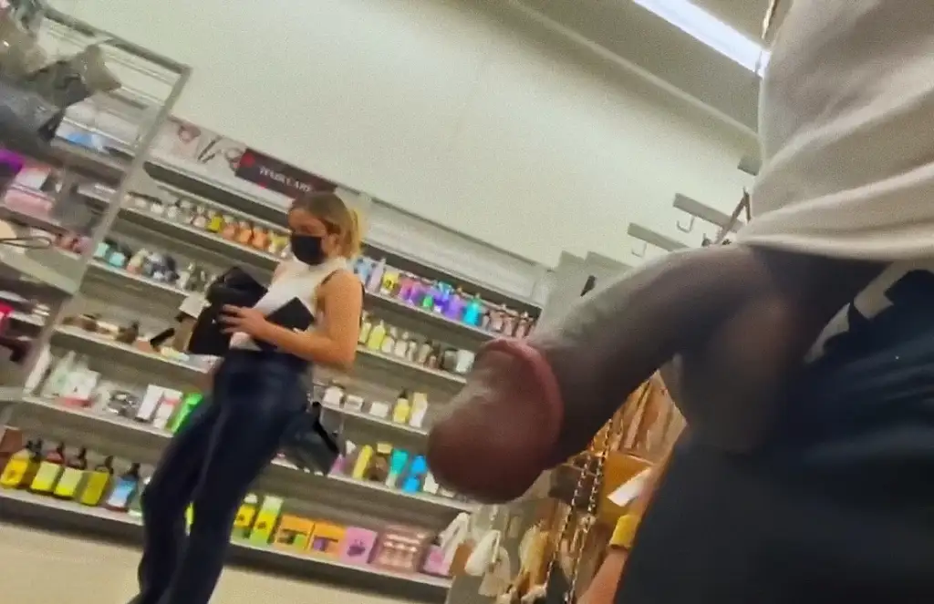 Hot brunette looking at products in the store