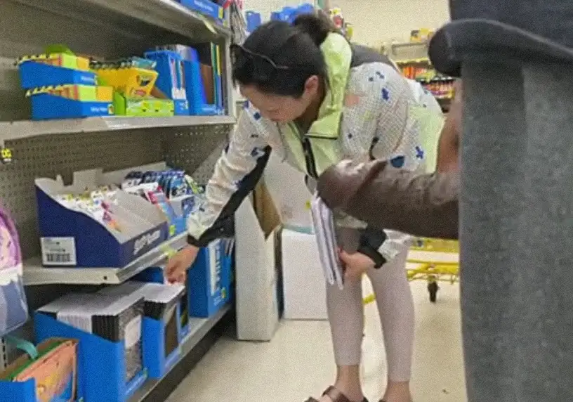 Mature Japanese looking at products in the store