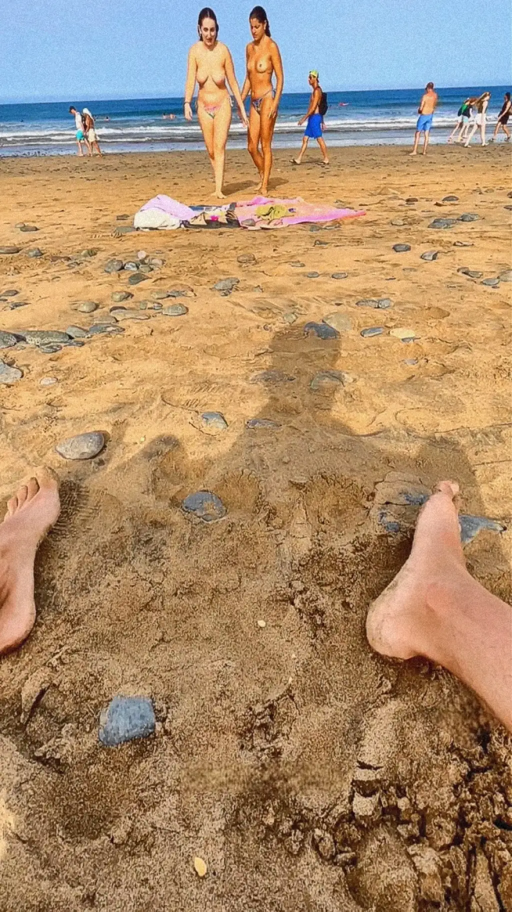 Hot topless friends looking at the dick on the beach 