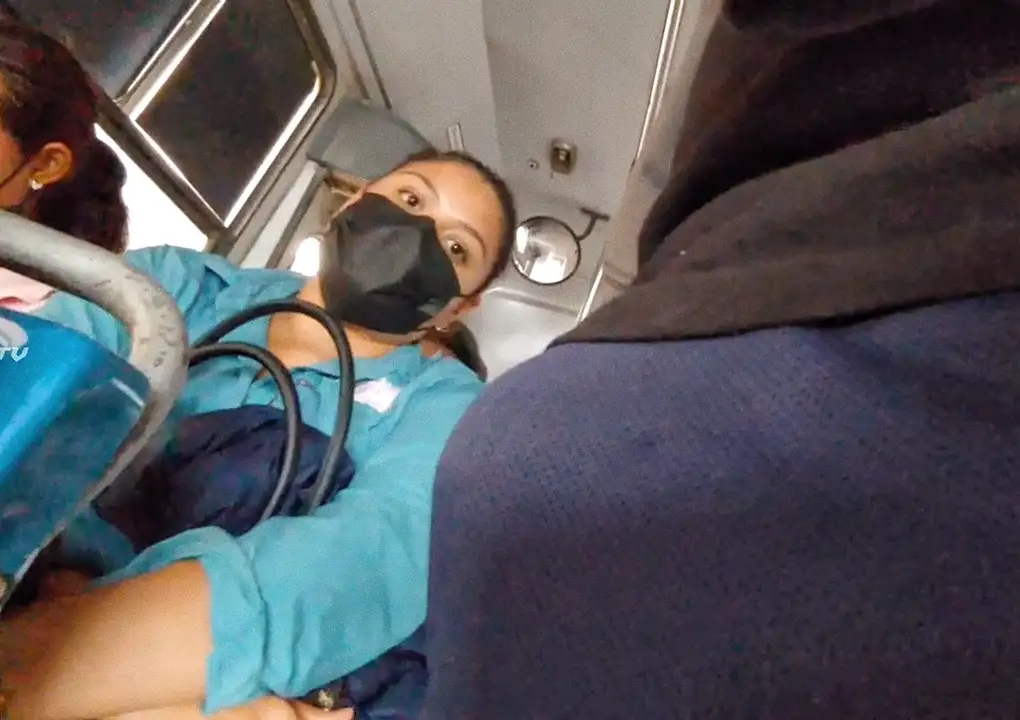 Latina looking at bulge on the bus