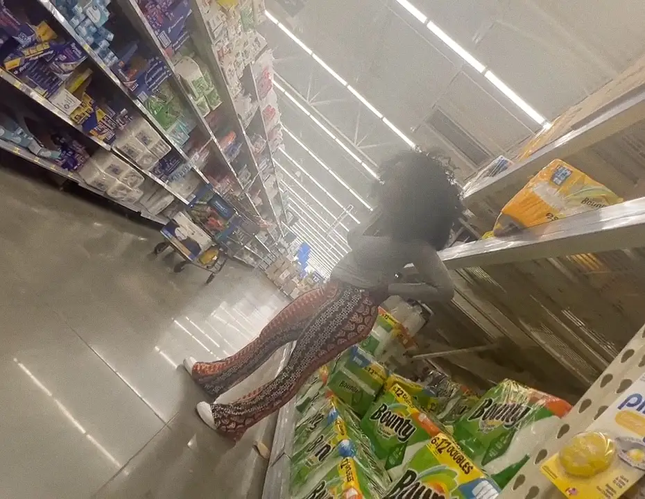 Hot ebony with an afro in the store